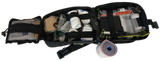 First aid kit with various supplies on a white background